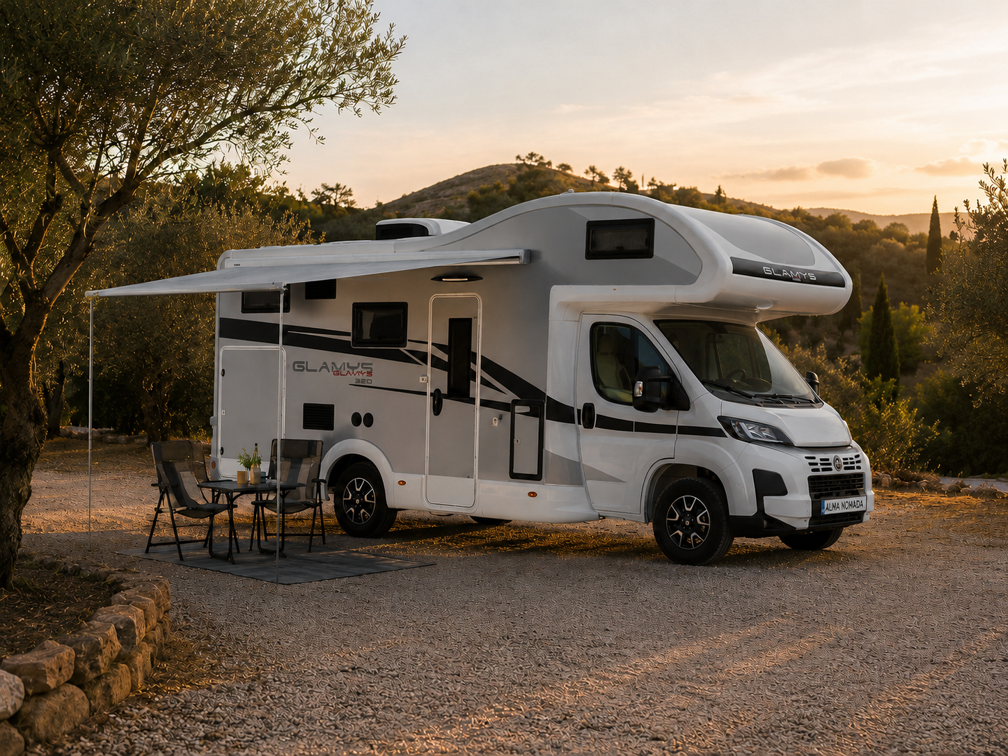 Autocaravana McLouis Glamys preparada para acampar junto a olivos